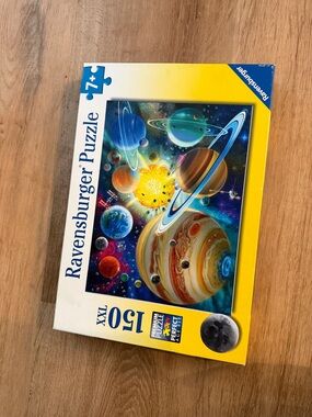 Ravensburger Solar System Puzzle with Bright Blue, Yellow and Green Planets